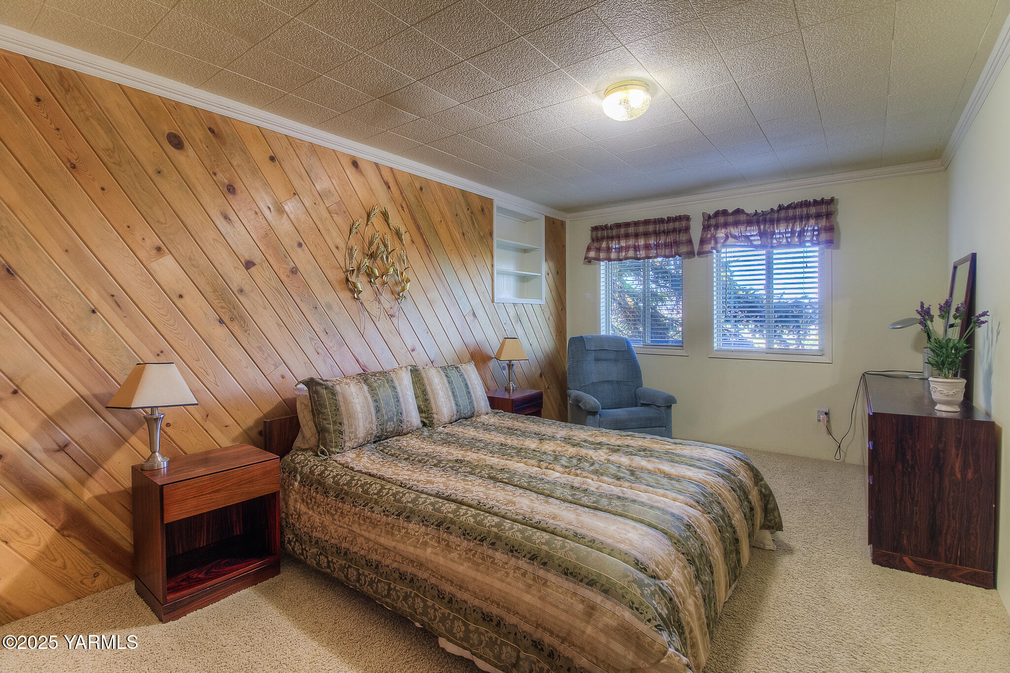 541 Basalt Springs Way Yakima, WA 98908 - Photo 38 of 51 a bedroom with a bed and a night stand with exposed radiator