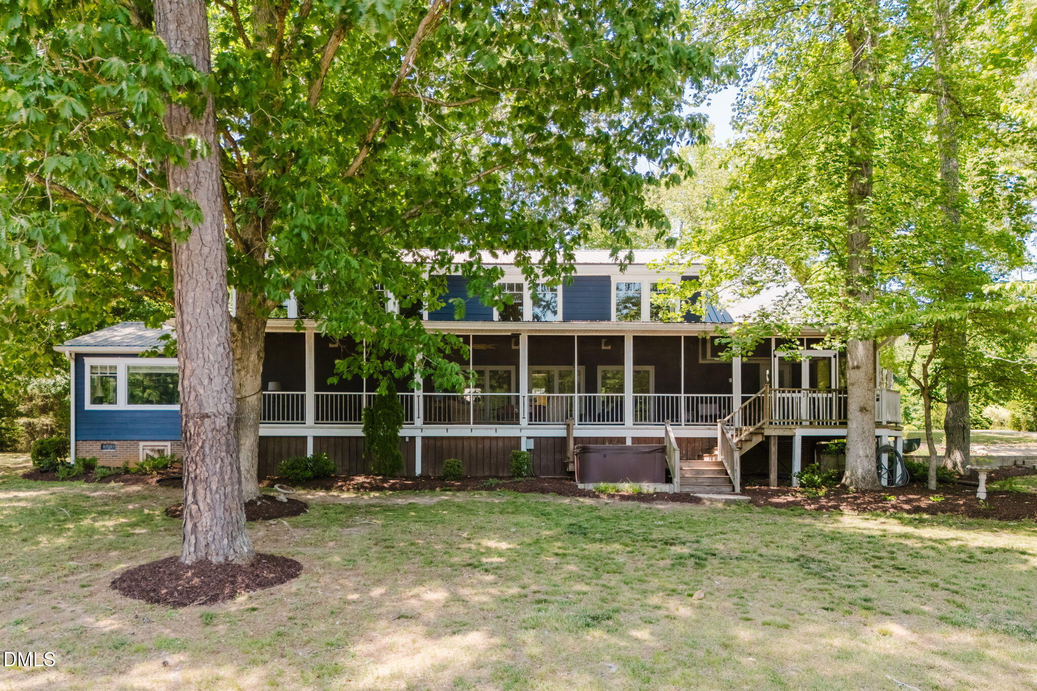 370 Robinson Ferry Road Macon, NC 27551 - Photo 11 of 85 a view of a house with backyard and a tree