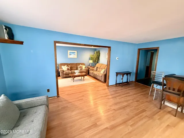 a view of livingroom with furniture and workspace