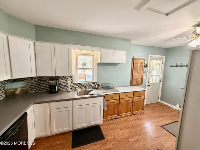 a kitchen with a sink and cabinets