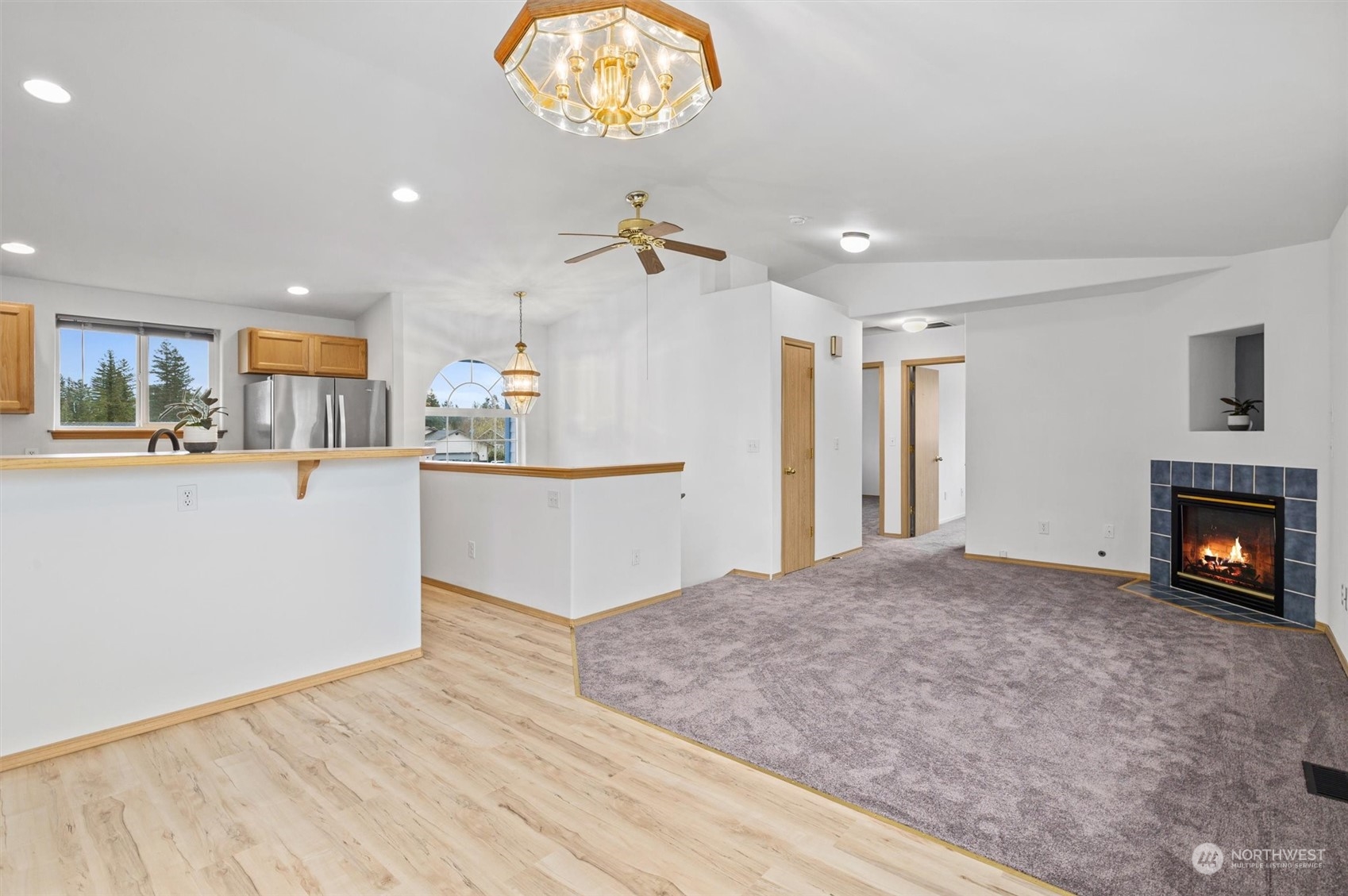219 Nugget Road Gold Bar, WA 98251 - Photo 3 of 39 a view of a kitchen with furniture and a fireplace