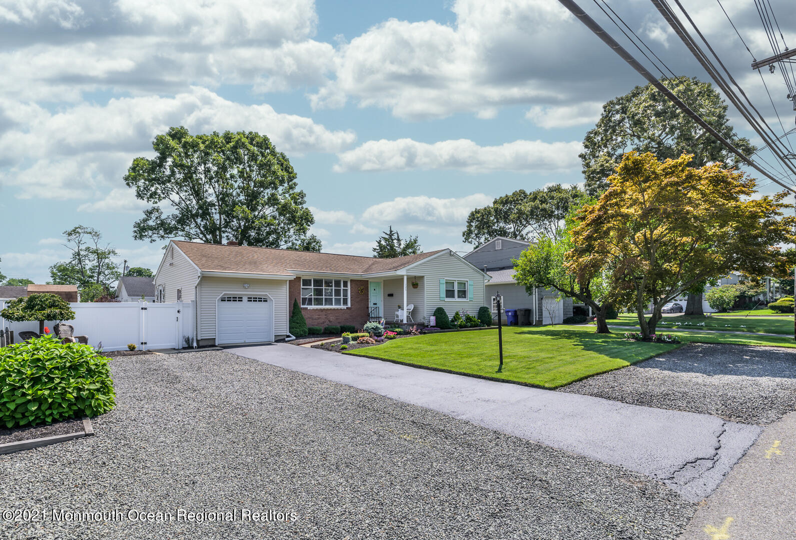 125 Jordan Road Brick, NJ 08724 - Photo 3 of 28 a white house with a big yard and large trees