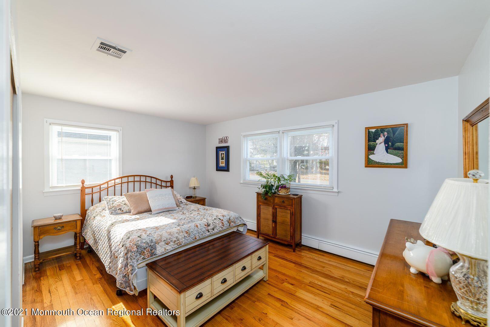 125 Jordan Road Brick, NJ 08724 - Photo 7 of 28 a bedroom with a bed and wooden floor