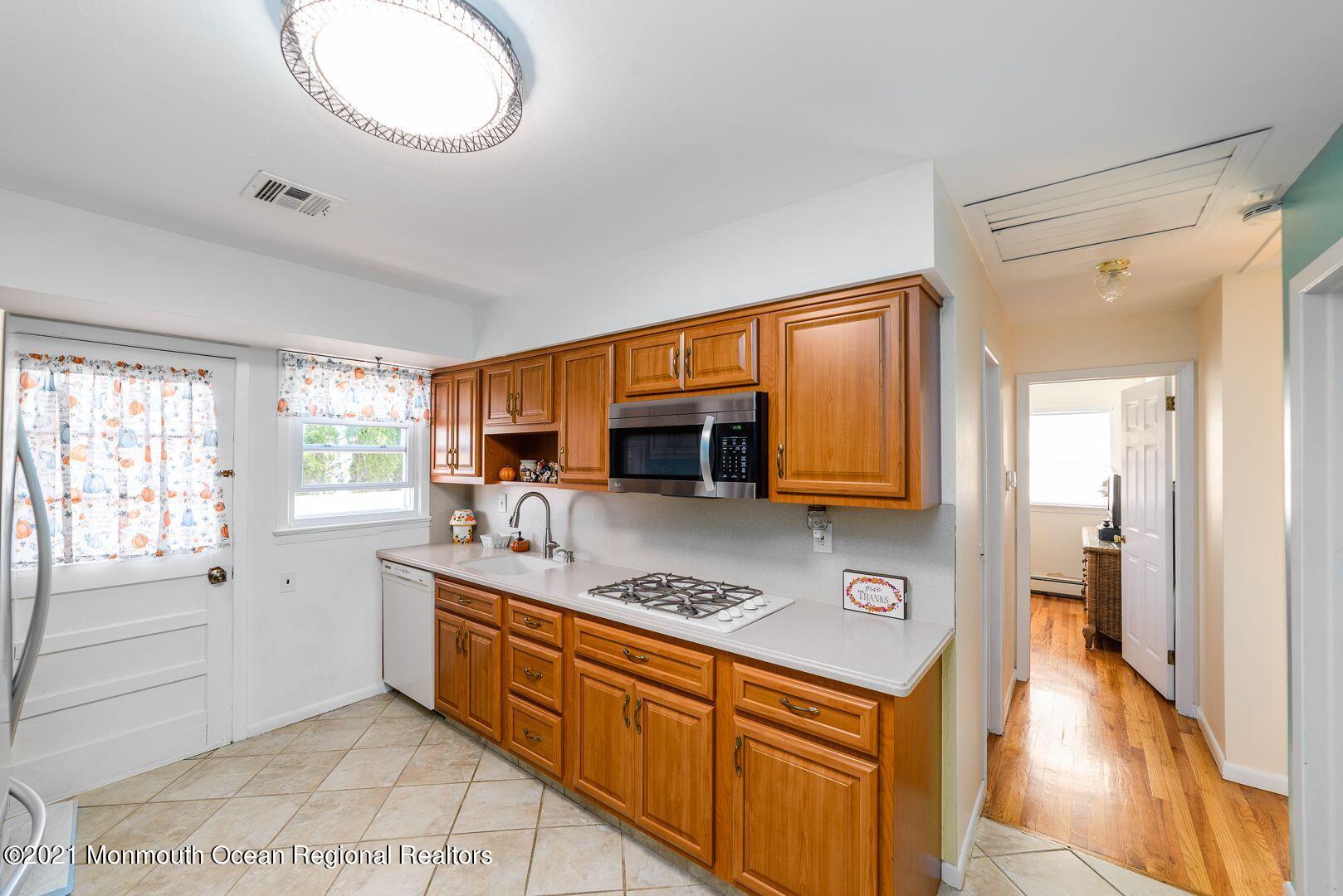 125 Jordan Road Brick, NJ 08724 - Photo 10 of 28 a kitchen with stainless steel appliances granite countertop a stove a sink and a refrigerator