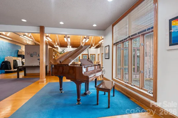 a view of entryway dining room and hall with wooden floor