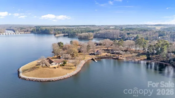 a view of a lake in middle of forest
