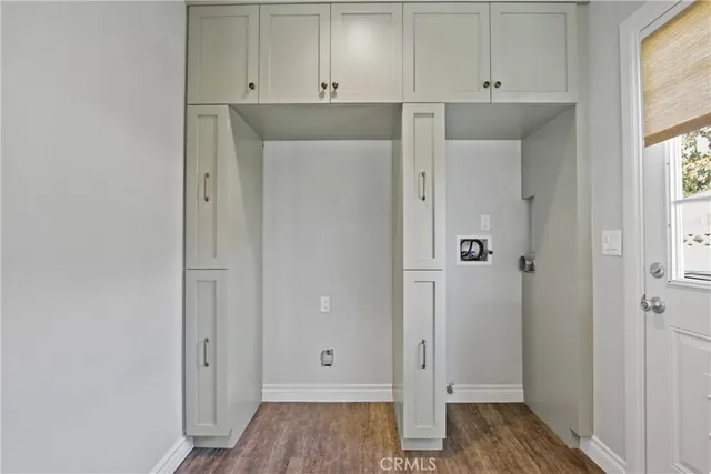 a view of cabinets and wooden floor