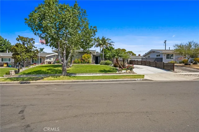 a swimming pool with outdoor seating and yard