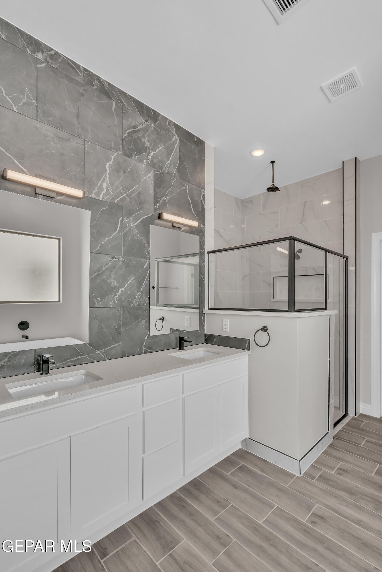 1849 War Path El Paso, TX 79911 - Photo 16 of 18 a bathroom with a sink and a mirror