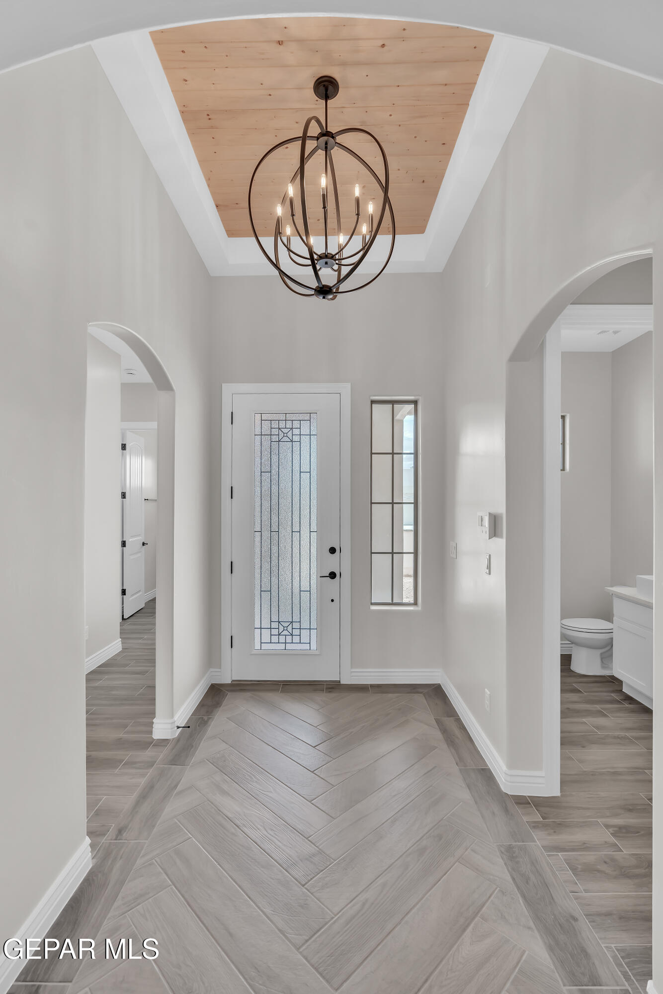 1849 War Path El Paso, TX 79911 - Photo 2 of 18 a view of an entryway with wooden floor