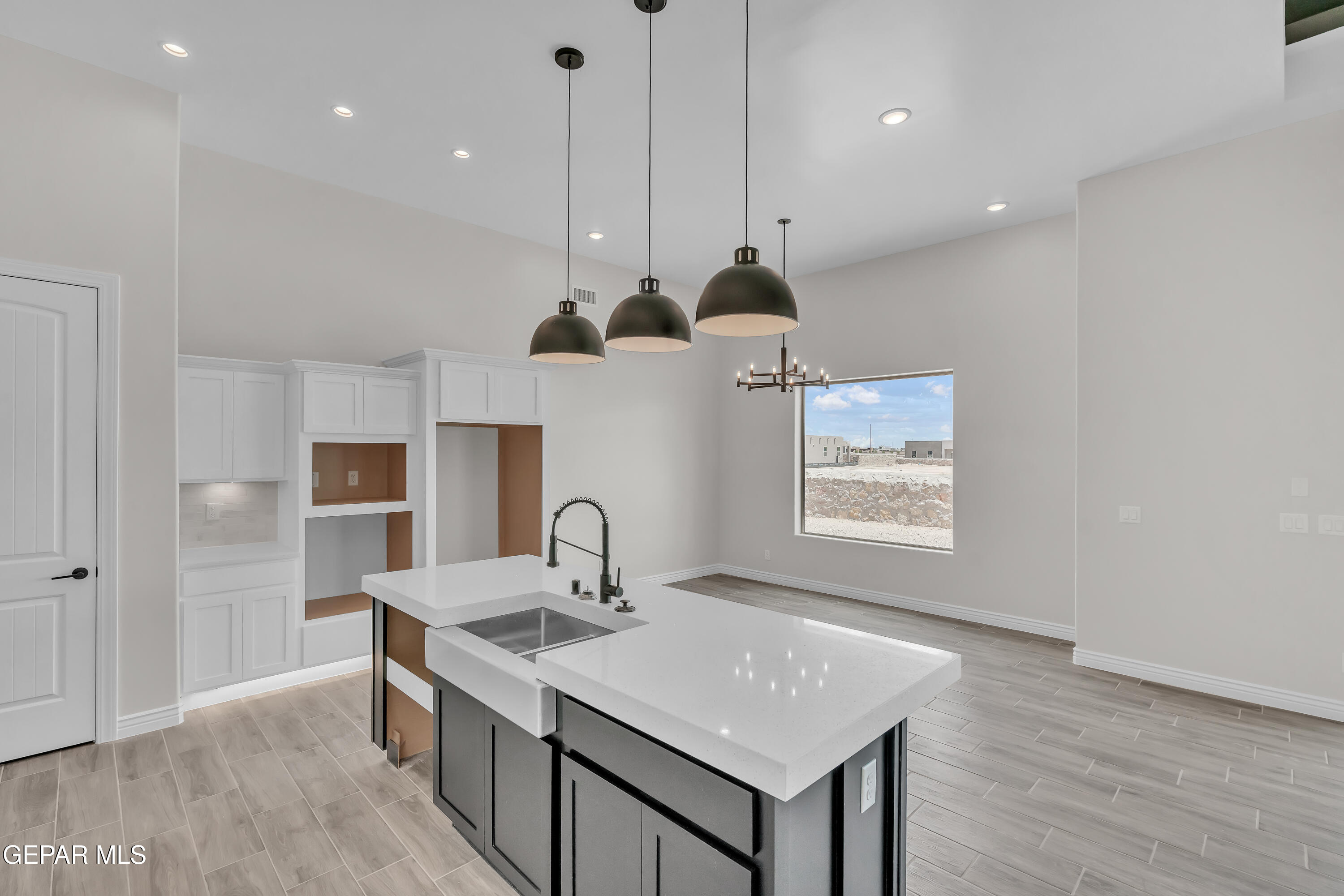 1849 War Path El Paso, TX 79911 - Photo 8 of 18 a kitchen with a sink a refrigerator and window