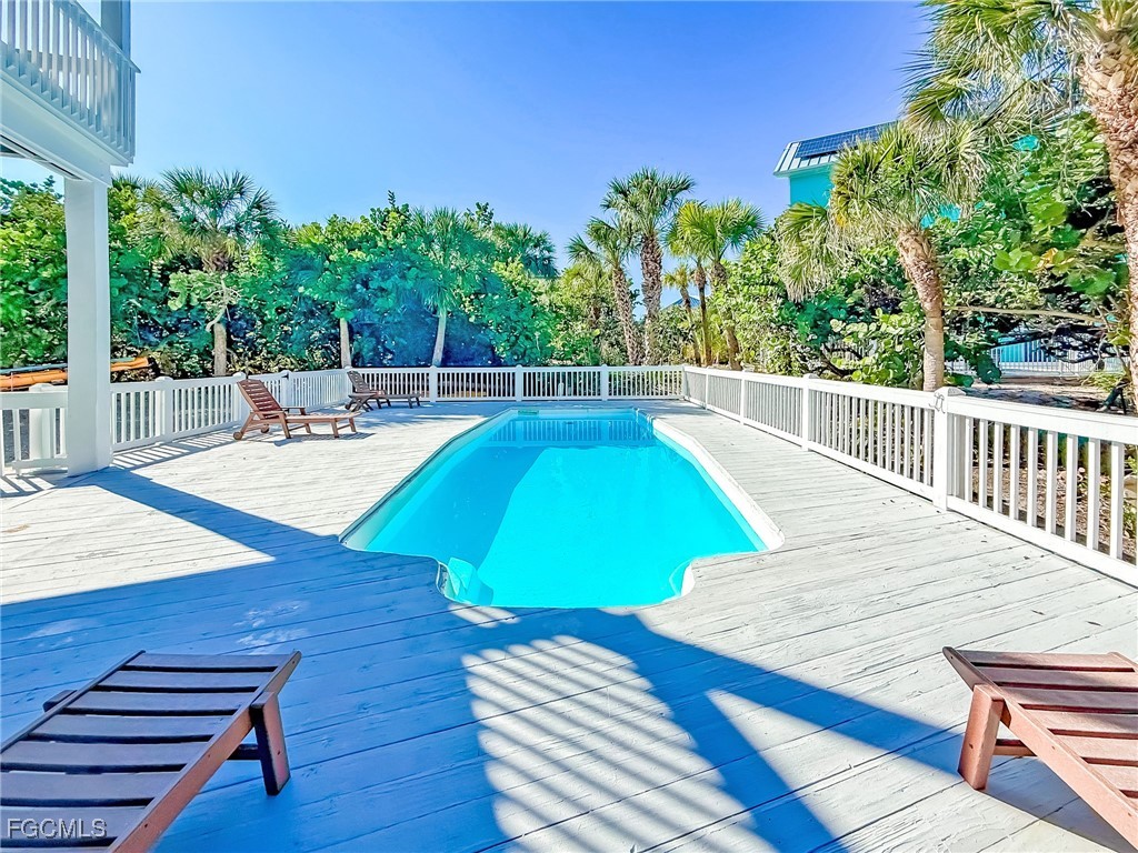 4560 Conch Shell Drive Upper Captiva, FL 33924 - Photo 11 of 50 a view of a swimming pool with a patio