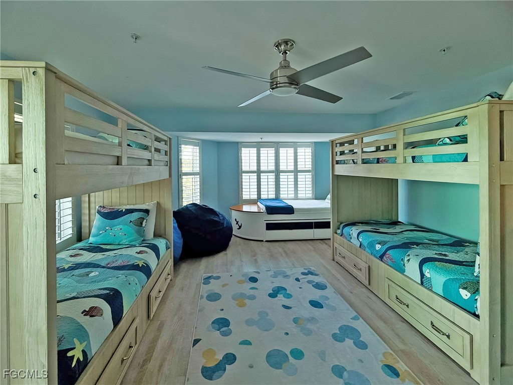 4560 Conch Shell Drive Upper Captiva, FL 33924 - Photo 17 of 50 a bedroom with a bed and a dresser