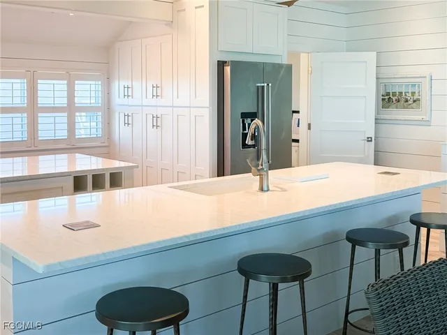 a room with a sink and a chair