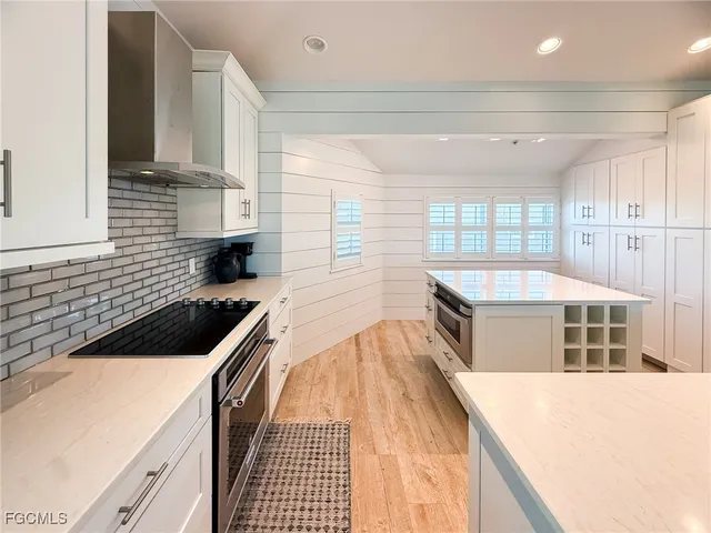 a kitchen that has a sink and a stove