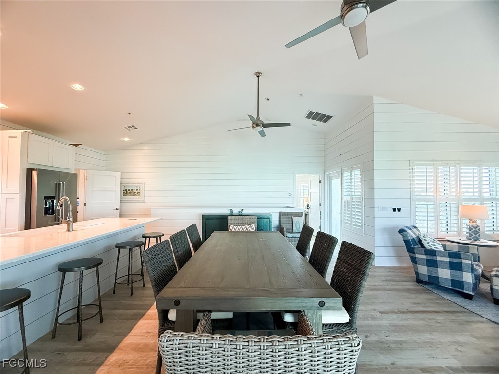 4560 Conch Shell Drive Upper Captiva, FL 33924 - Photo 35 of 50 a large kitchen with a table and chairs