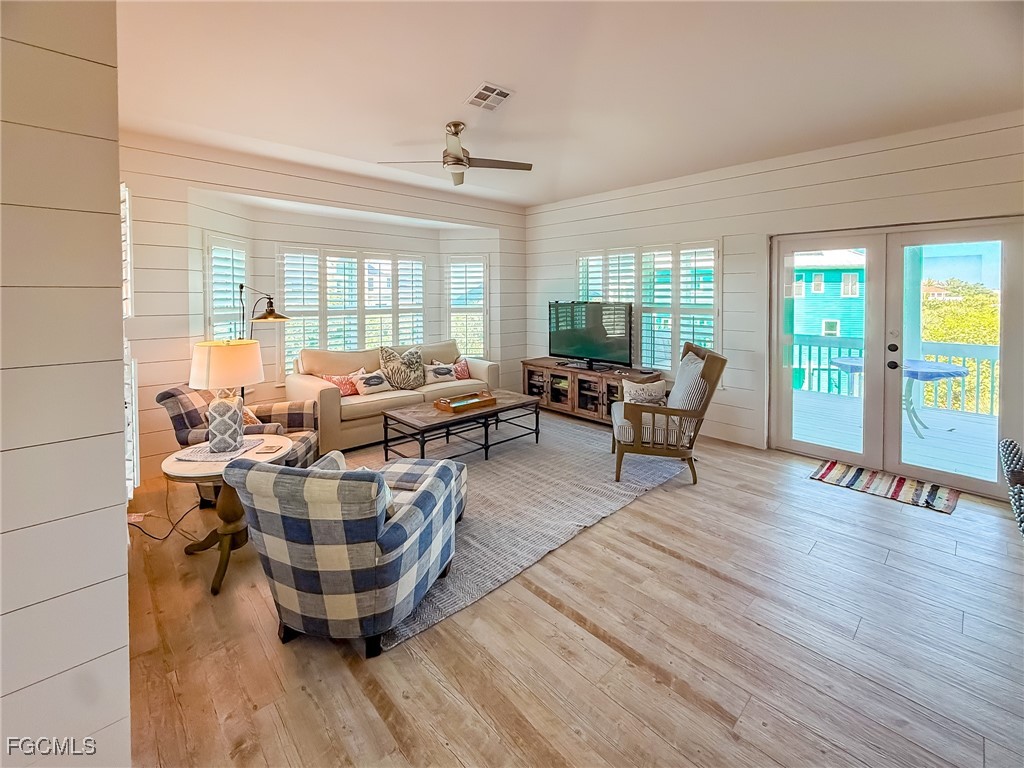 4560 Conch Shell Drive Upper Captiva, FL 33924 - Photo 36 of 50 a living room with furniture and wooden floor
