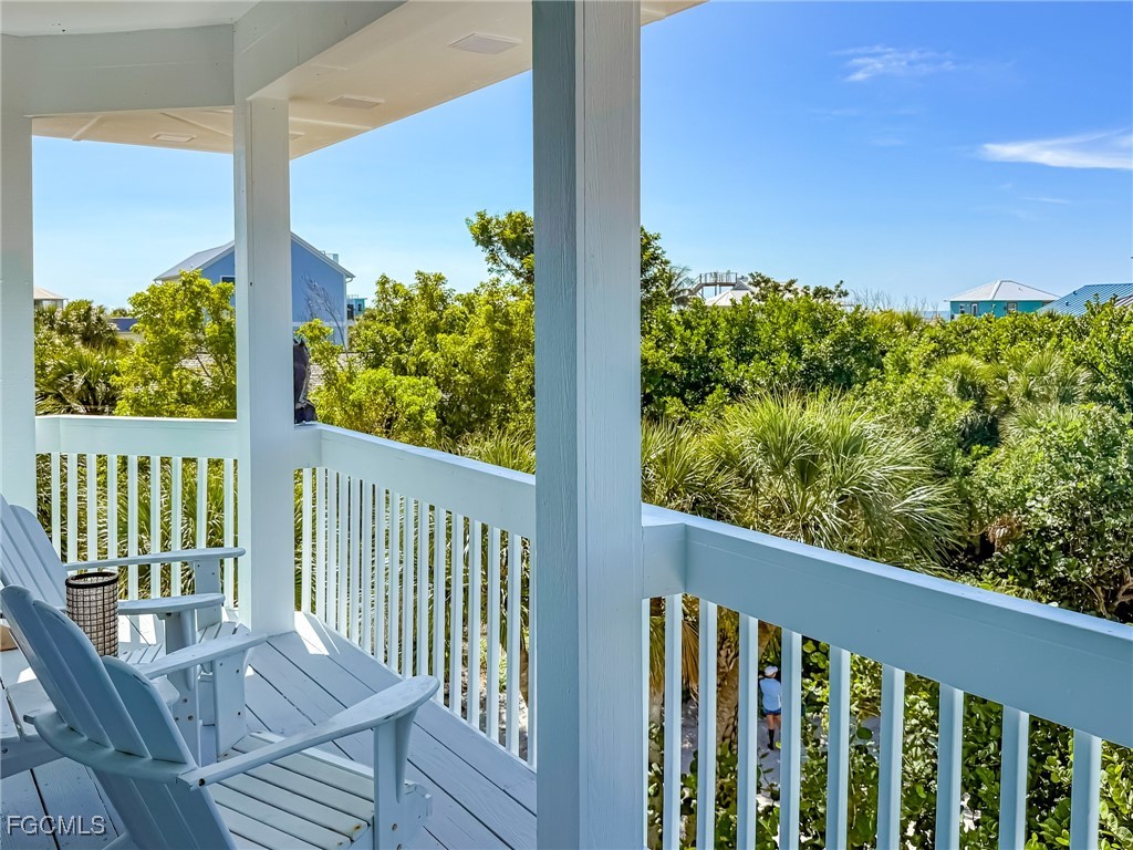 4560 Conch Shell Drive Upper Captiva, FL 33924 - Photo 43 of 50 a view of a balcony with plants