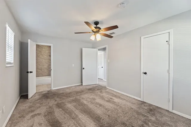 a bath room with a toilet and a shower