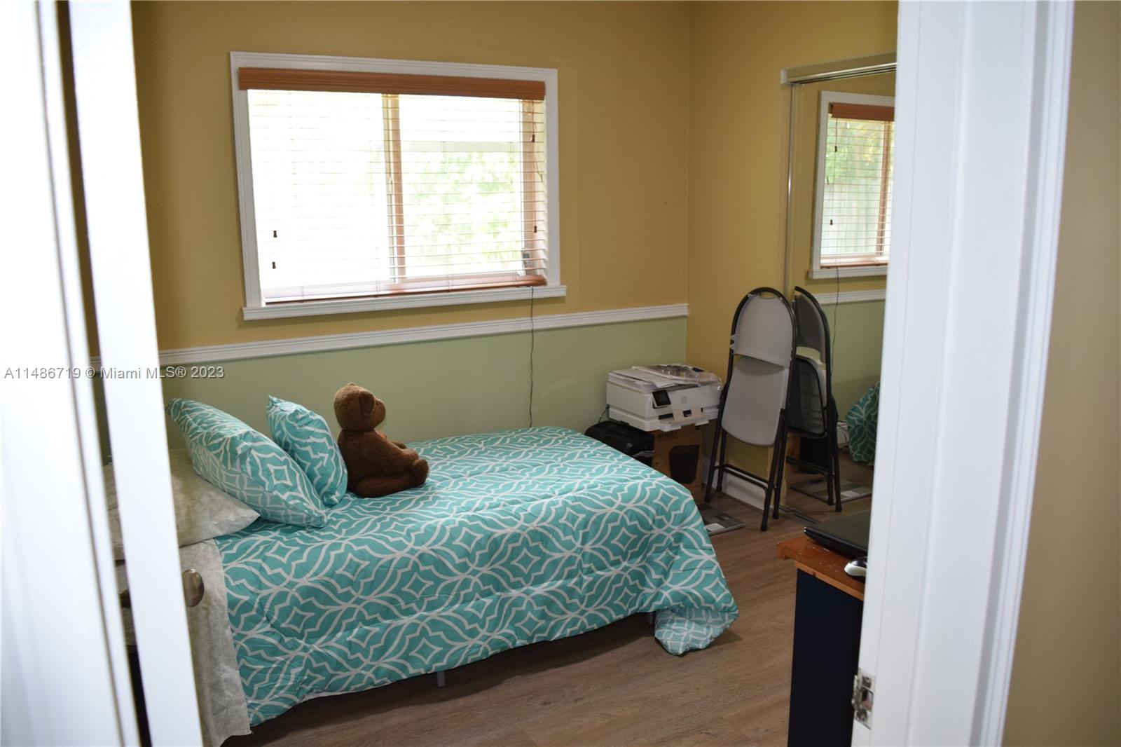 Palmetto Estates Miami, FL 33157 - Photo 11 of 20 a bedroom with a bed and window