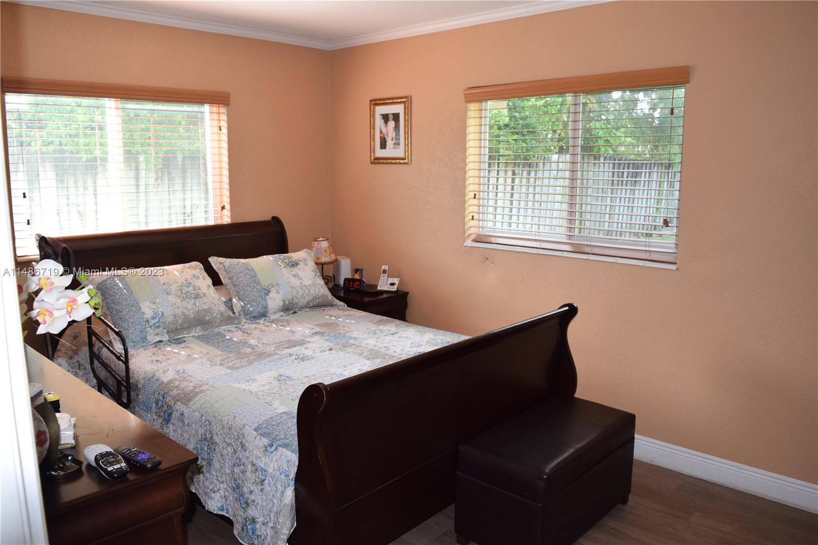 Palmetto Estates Miami, FL 33157 - Photo 12 of 20 a bed sitting in a bedroom next to a window