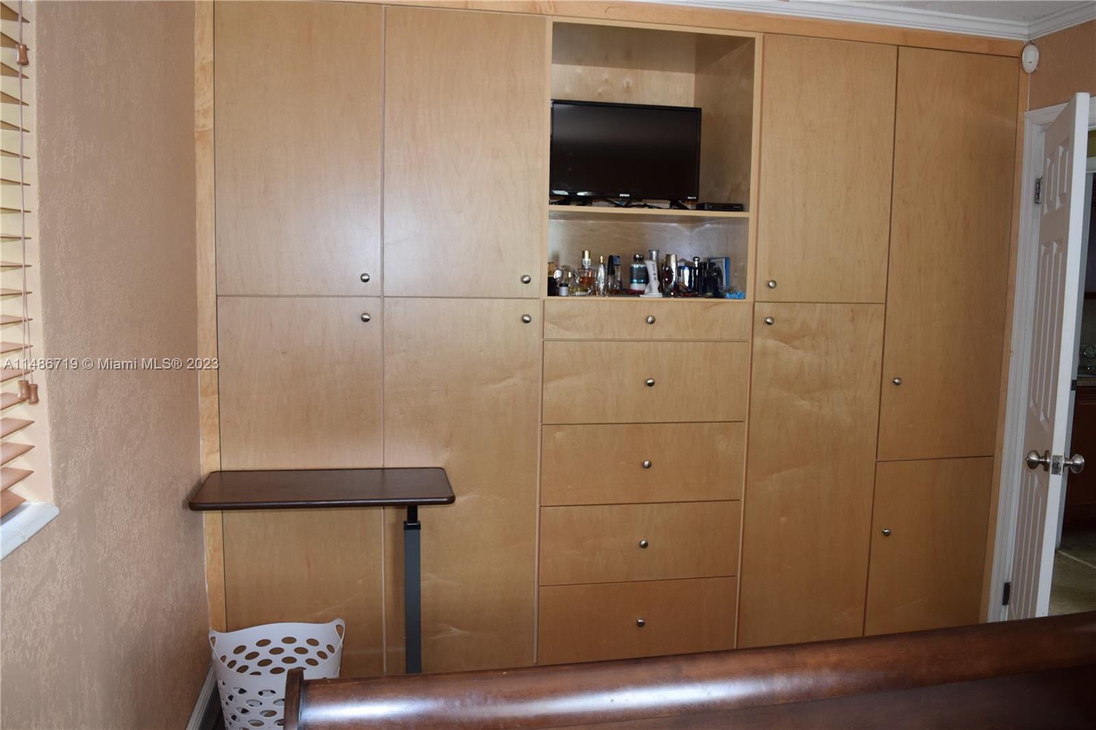 Palmetto Estates Miami, FL 33157 - Photo 13 of 20 a living room with a flat screen tv and a refrigerator