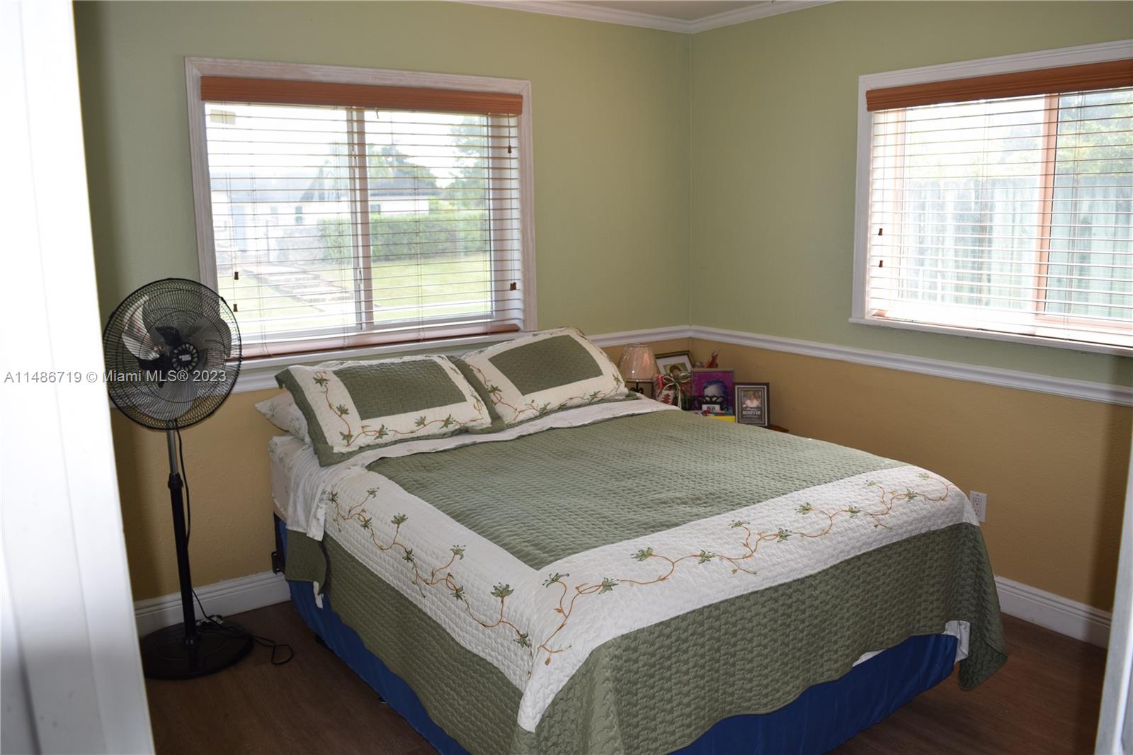 Palmetto Estates Miami, FL 33157 - Photo 14 of 20 a bedroom with a bed and a window