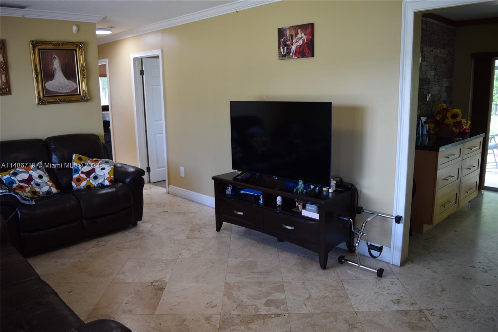 Palmetto Estates Miami, FL 33157 - Photo 17 of 20 a living room with furniture and a flat screen tv