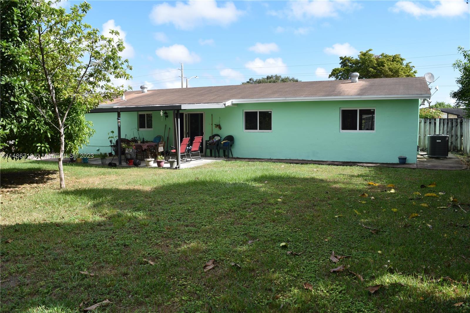 Palmetto Estates Miami, FL 33157 - Photo 5 of 20 a view of a house with a yard porch and sitting area