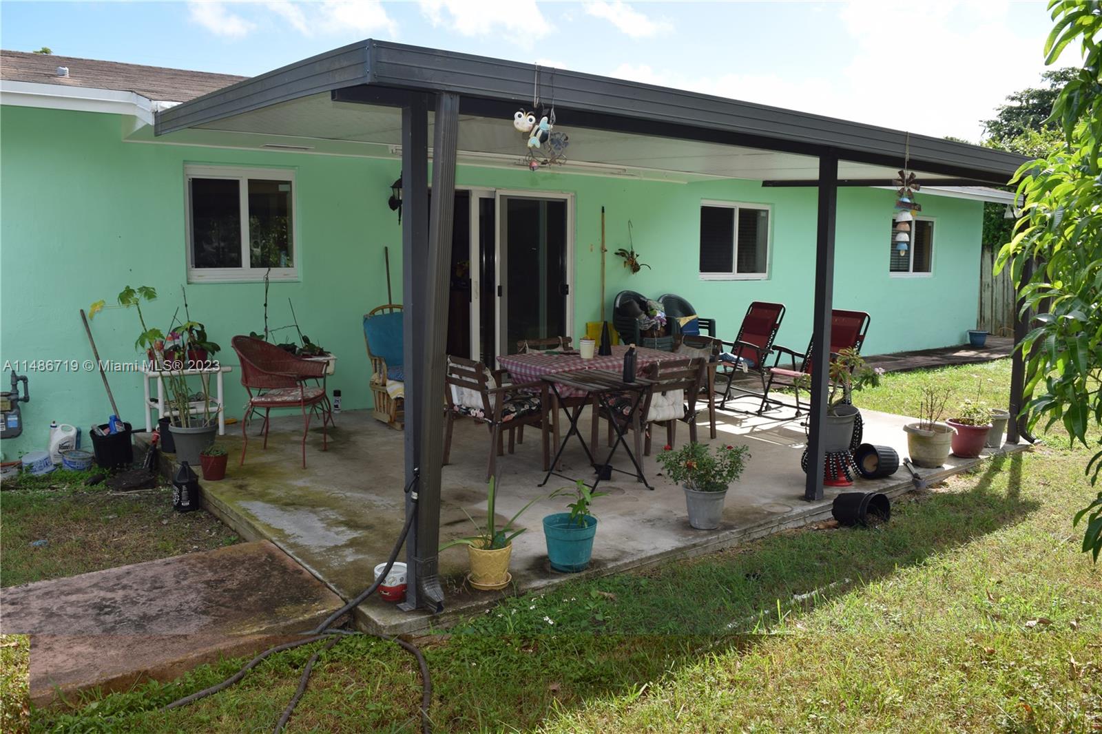 Palmetto Estates Miami, FL 33157 - Photo 6 of 20 a view of a house with backyard porch and sitting area