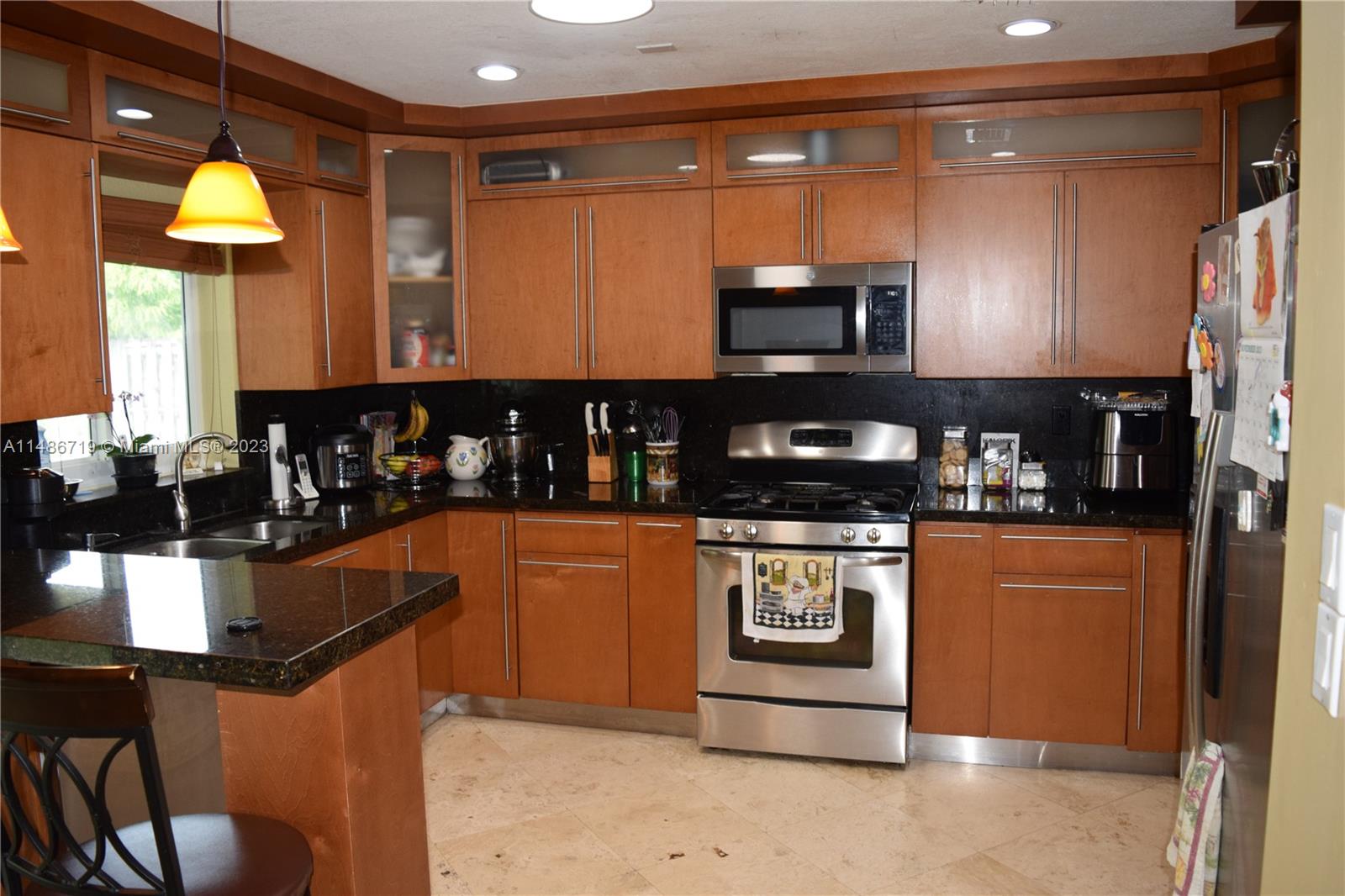 Palmetto Estates Miami, FL 33157 - Photo 7 of 20 a kitchen with stainless steel appliances granite countertop a refrigerator a stove and a sink