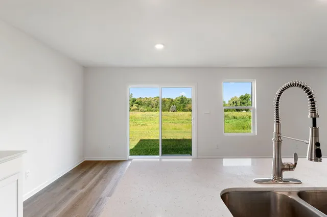 a view of a room with a large window