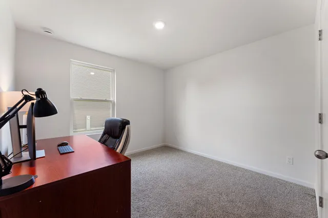 a view of a room with a sink and cabinets
