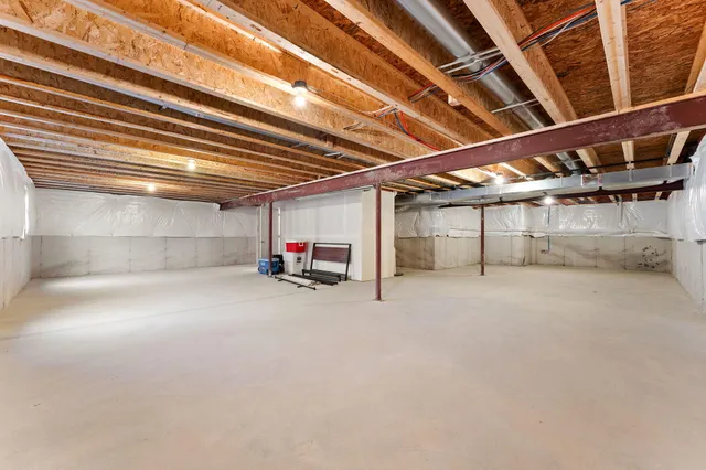 a view of a empty room with a ceiling fan