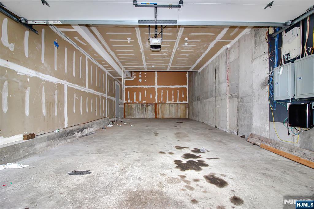 8913 Riverside Place, Unit 3 North Bergen, NJ 07047 - Photo 15 of 17 a view of a livingroom with wooden floor and windows