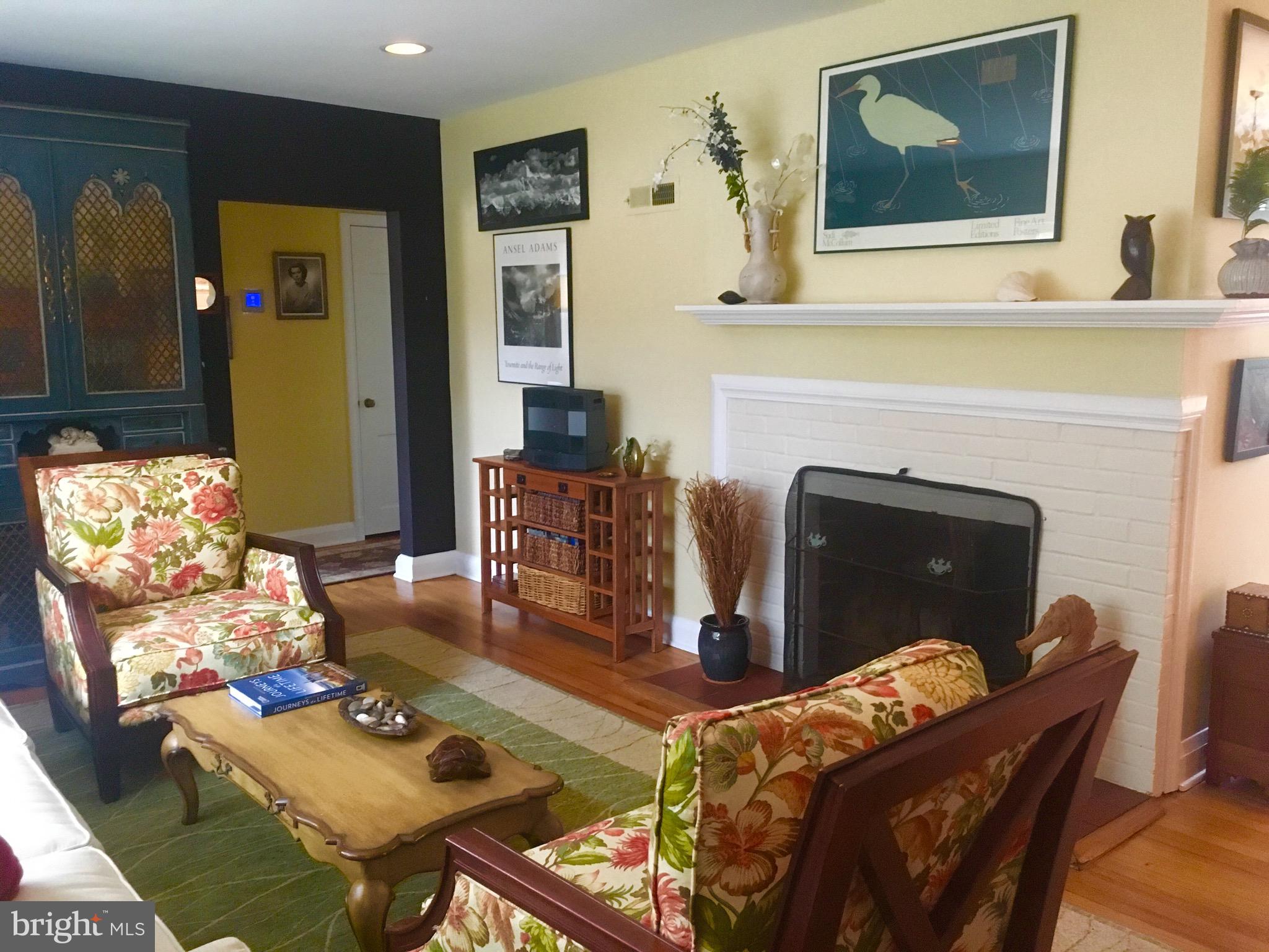 409 Range Road Towson, MD 21204 - Photo 2 of 14 Bright living room with wood burning fireplace