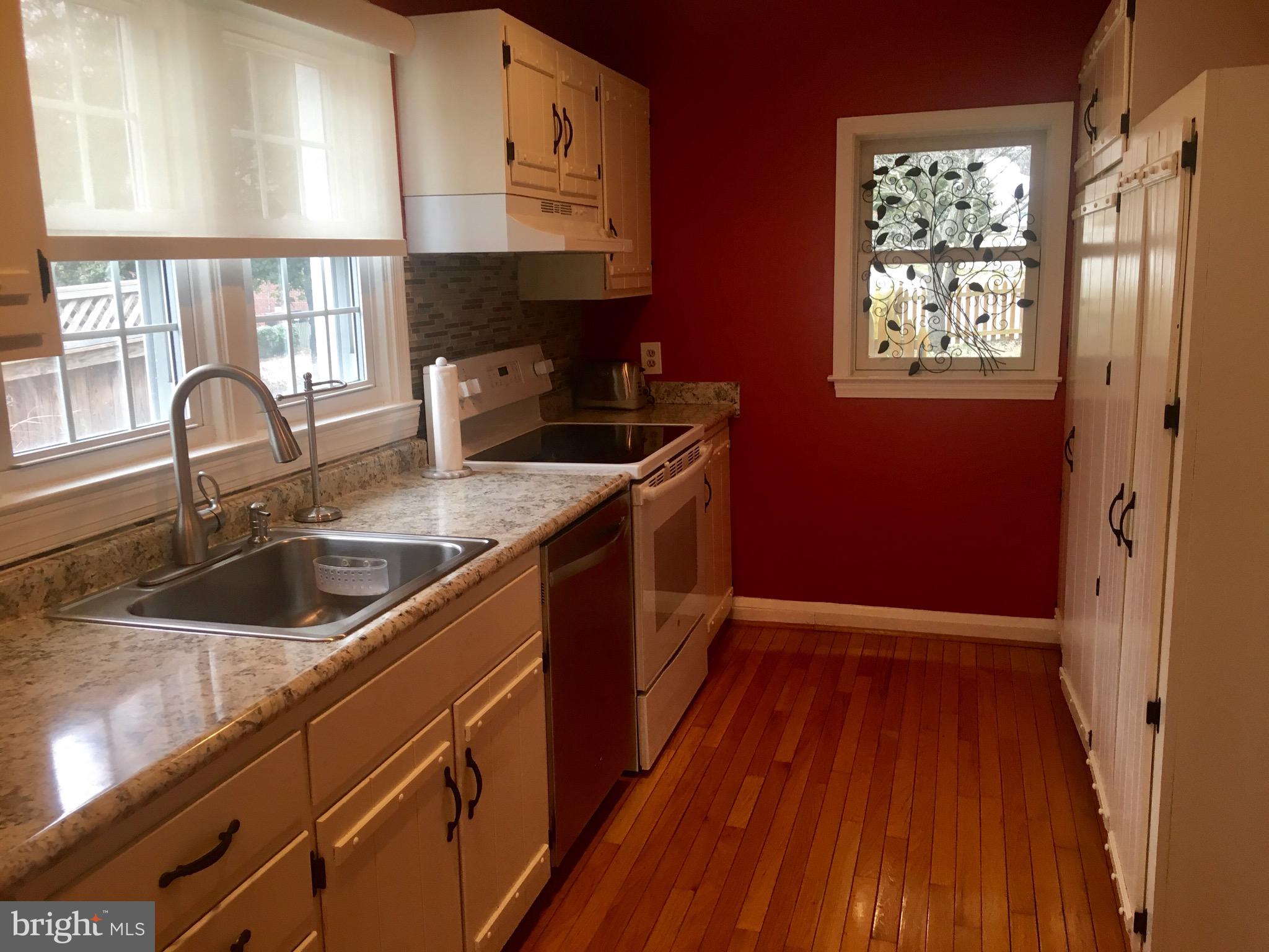 409 Range Road Towson, MD 21204 - Photo 4 of 14 Kitchen with white cabinets