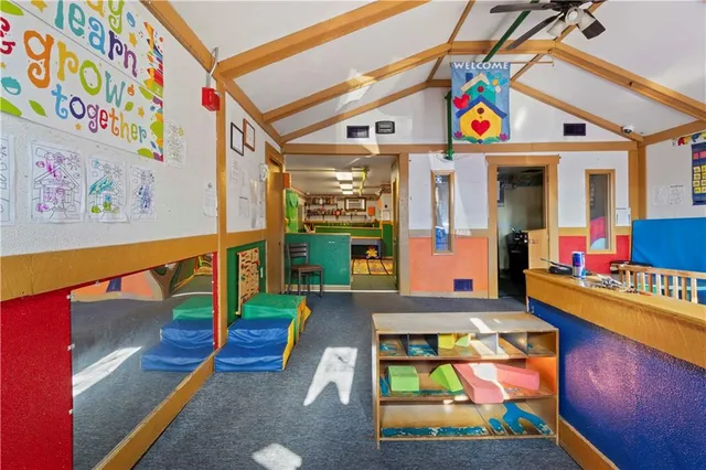 a view of an entryway with wooden floor