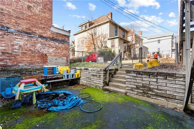 a house view with a backyard space