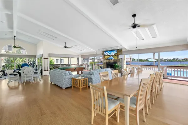 a dining room with furniture and wooden floor