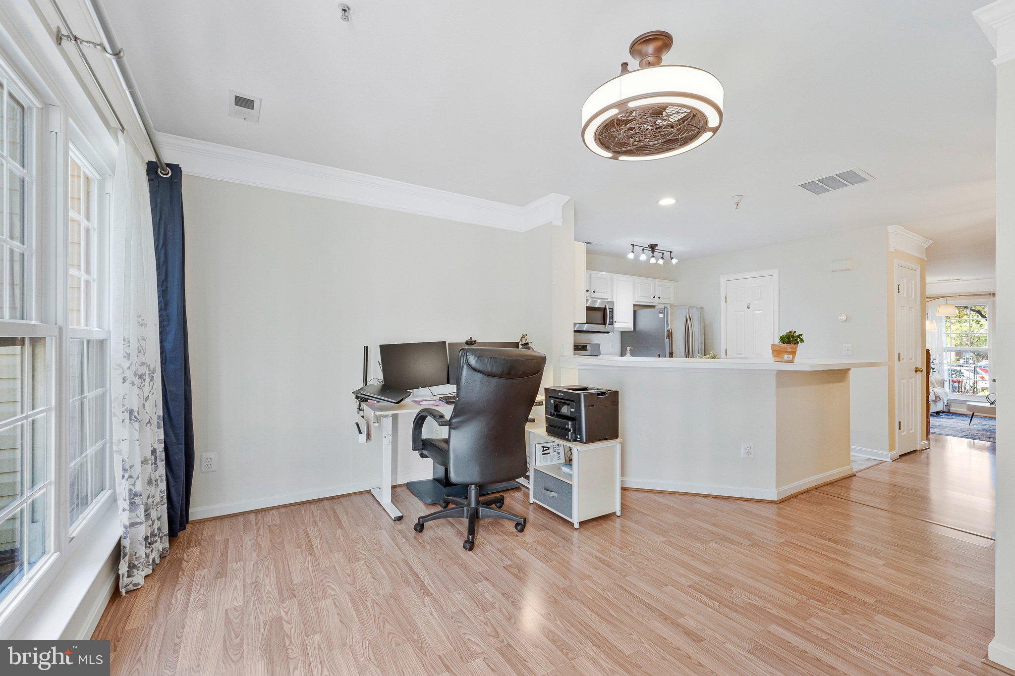 21789 Baldwin Square, Unit 21789 Sterling, VA 20164 - Photo 11 of 33 a workspace with furniture hardwood and a window