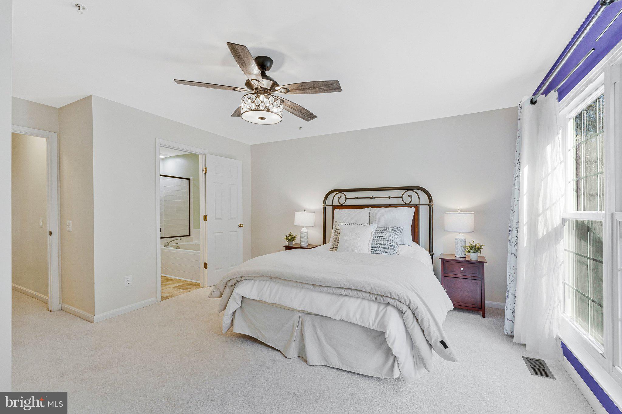 21789 Baldwin Square, Unit 21789 Sterling, VA 20164 - Photo 15 of 33 a bedroom with a bed and window