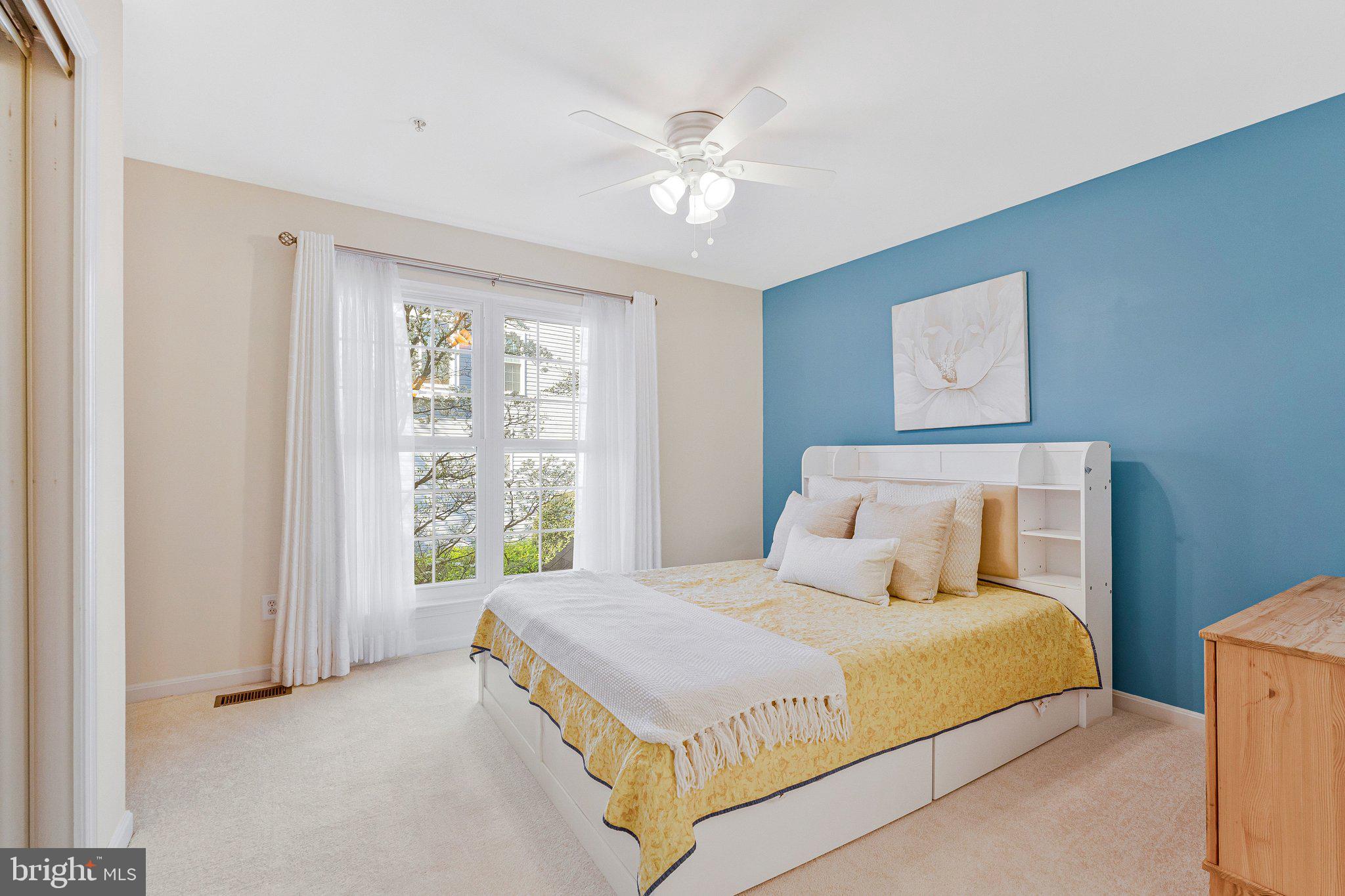 21789 Baldwin Square, Unit 21789 Sterling, VA 20164 - Photo 21 of 33 a bedroom with a bed and window