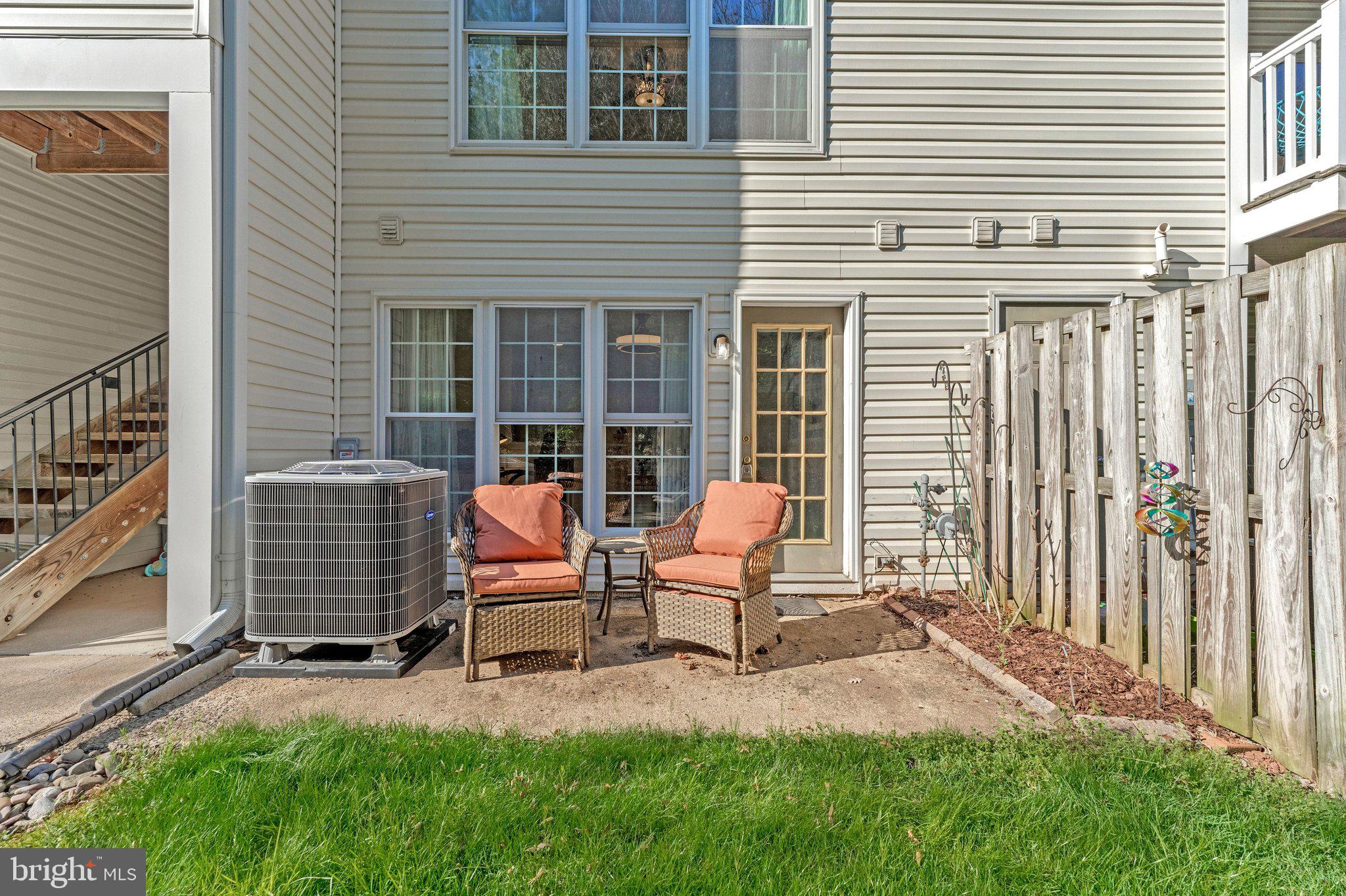 21789 Baldwin Square, Unit 21789 Sterling, VA 20164 - Photo 26 of 33 a backyard of a house with seating space