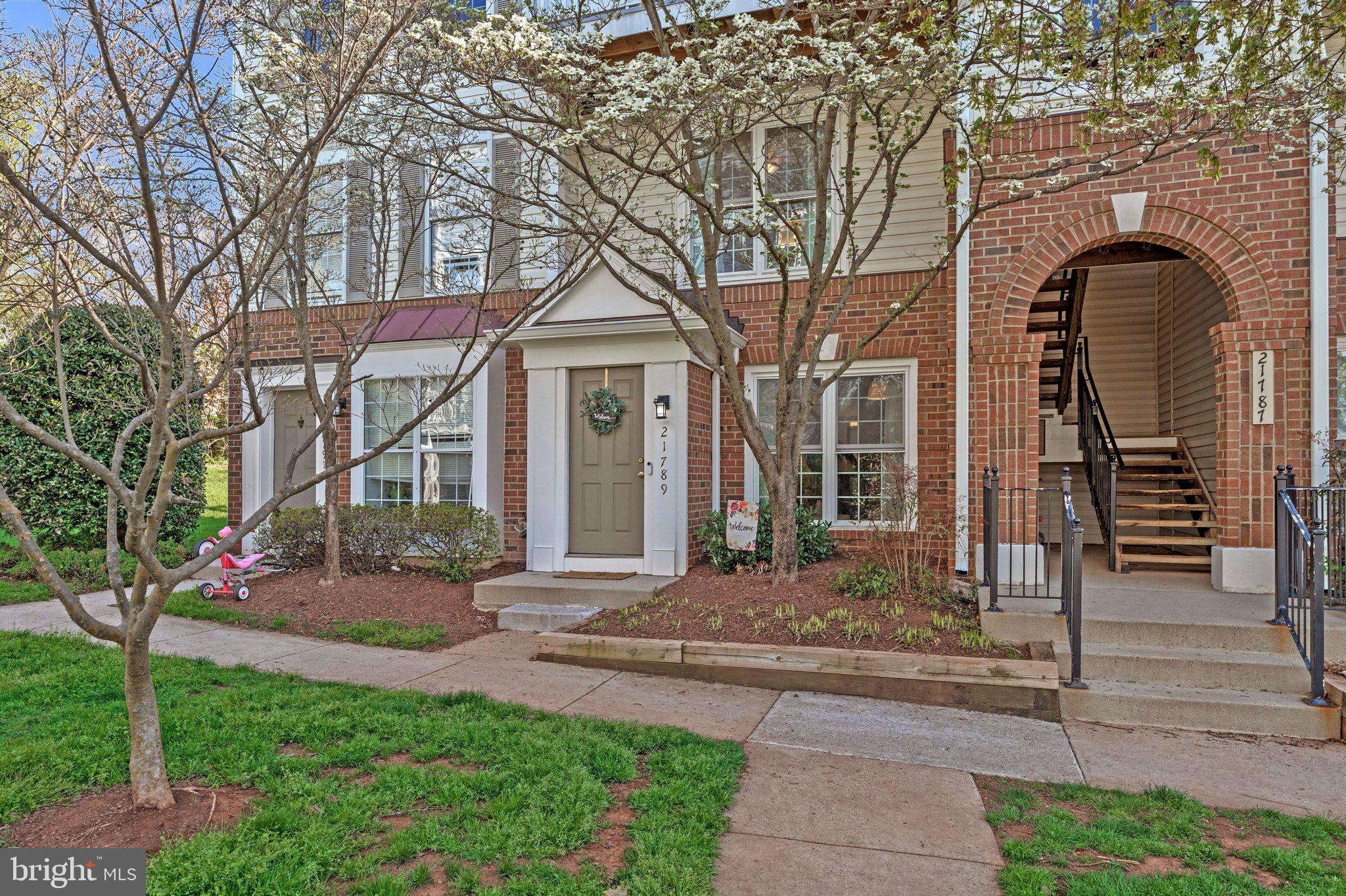 21789 Baldwin Square, Unit 21789 Sterling, VA 20164 - Photo 29 of 33 a front view of a house with garden
