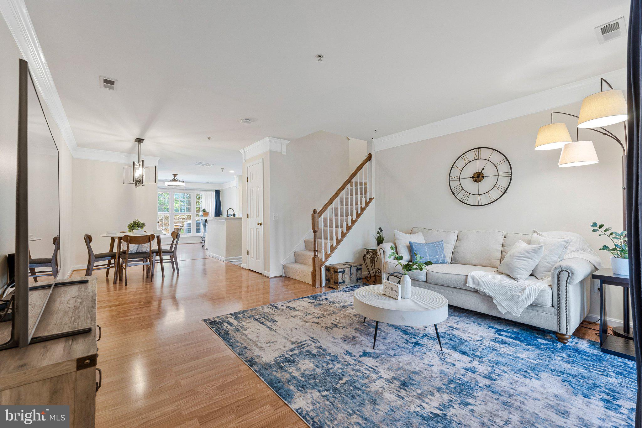 21789 Baldwin Square, Unit 21789 Sterling, VA 20164 - Photo 3 of 33 a living room with furniture and wooden floor