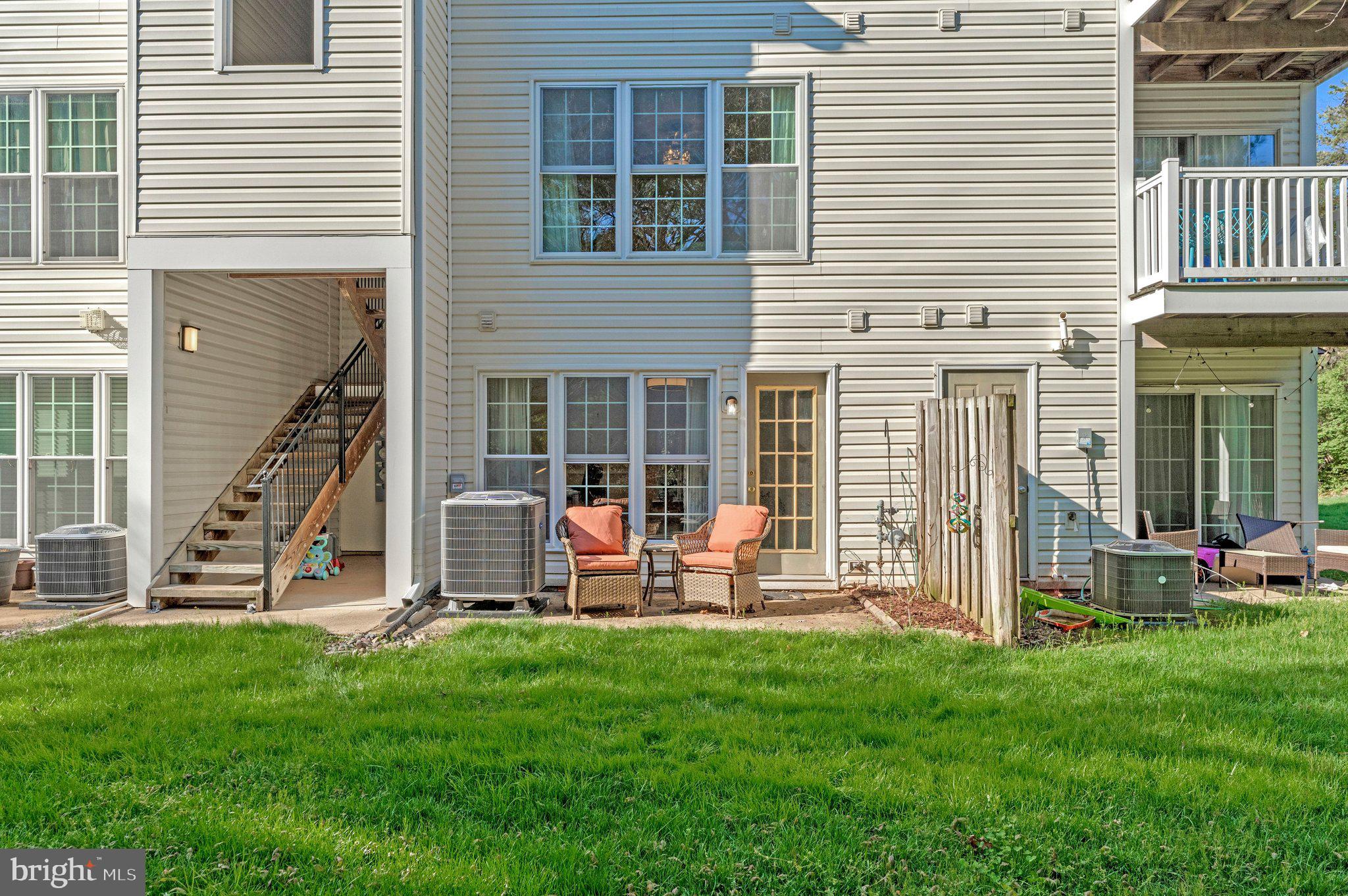 21789 Baldwin Square, Unit 21789 Sterling, VA 20164 - Photo 32 of 33 a view of a house with backyard
