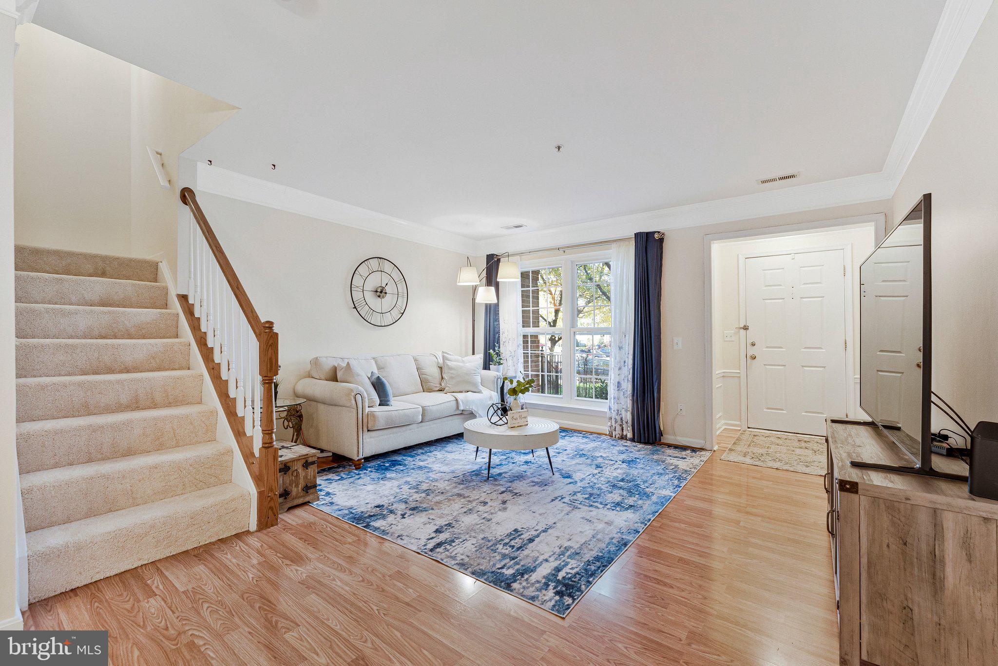 21789 Baldwin Square, Unit 21789 Sterling, VA 20164 - Photo 4 of 33 a living room with furniture and a large window