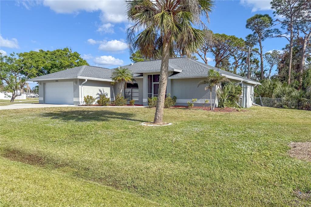 3243 Sunset Beach Drive Venice, FL 34293 - Photo 1 of 1 a front view of a house with garden