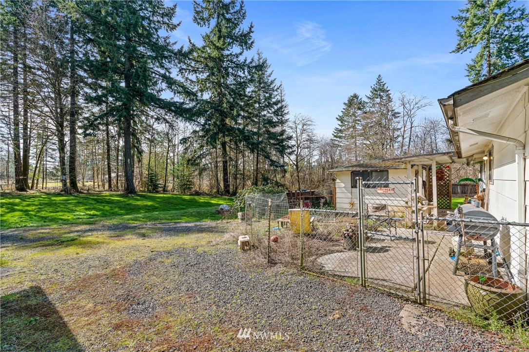 187 Limmer Road Winlock, WA 98596 - Photo 15 of 17 a view of a house with backyard and a tree